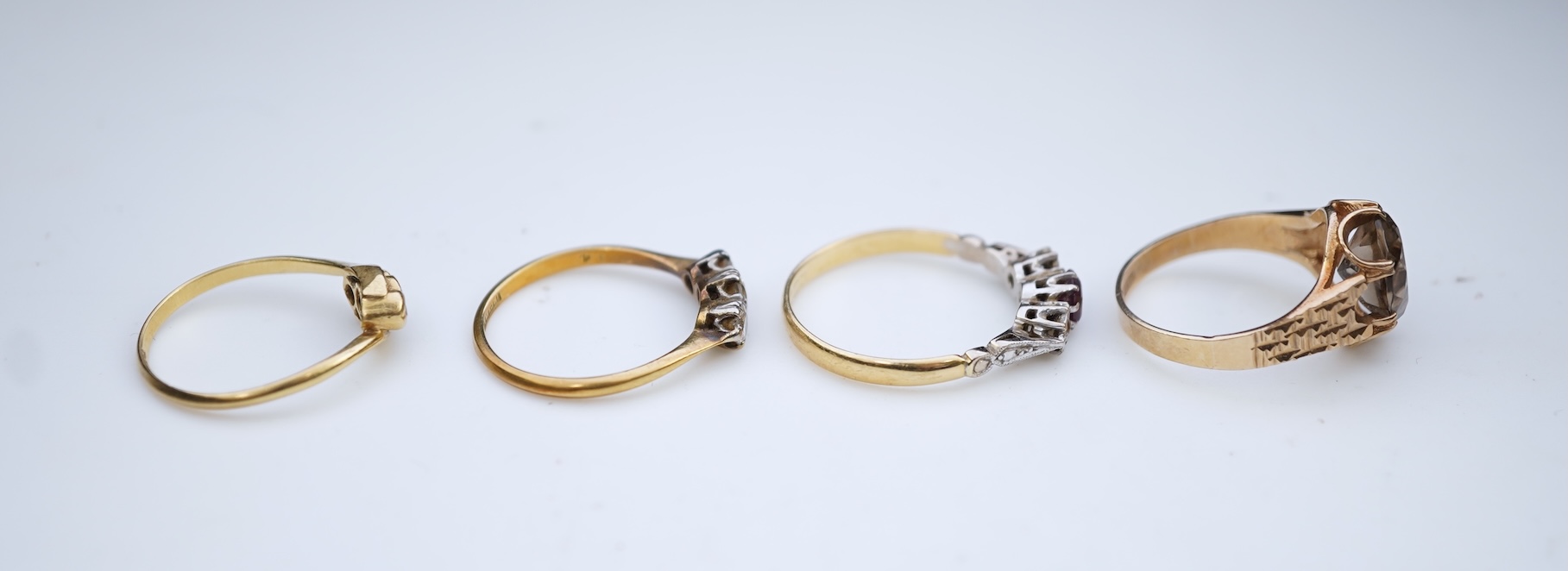 Four gem-set rings